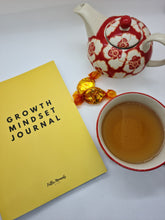 Load image into Gallery viewer, Fuller Moments Growth Mindset Journal with cup of tea indicating self care time
